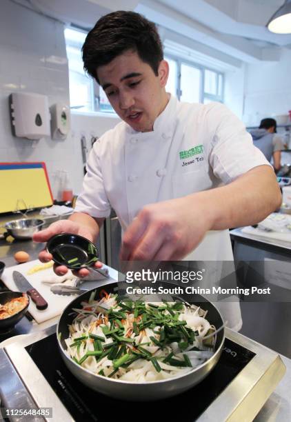 Jesse Teh, head chef of Secret Ingredients, demonstrates how to make prawn char kway teow. 19NOV13