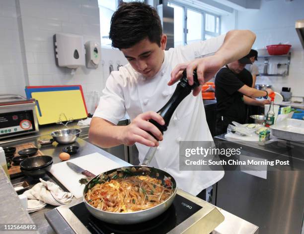 Jesse Teh, head chef of Secret Ingredients, demonstrates how to make prawn char kway teow. 19NOV13