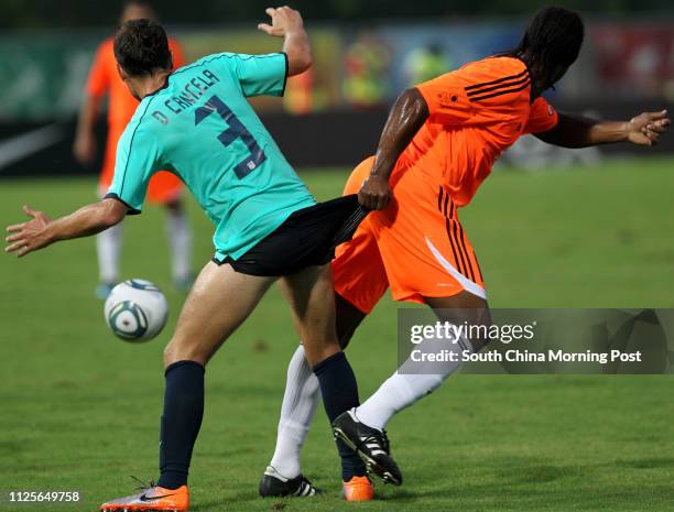 Kitchee player no.3 Daniel Cancela and Sun Hei player no.16 Gerard Ambassa Guy. Soccer league opening match between Kitchee and Sunray Cave Sun Hei...