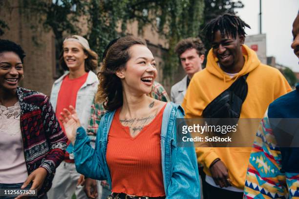 friends walking to university - british culture stock pictures, royalty-free photos & images