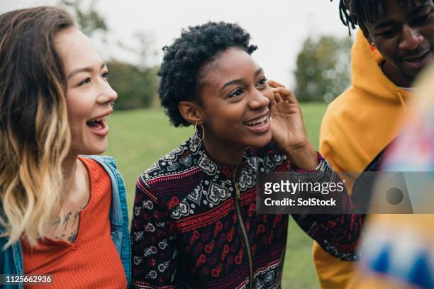 friends in a public park - youth culture stock pictures, royalty-free photos & images