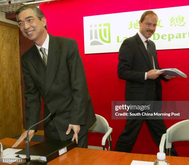 Director of Lands, Patrick Lau Lai-chiu , and Assistant Director Christopher Mills, attend a press conference to announce the 2004/2005 application...