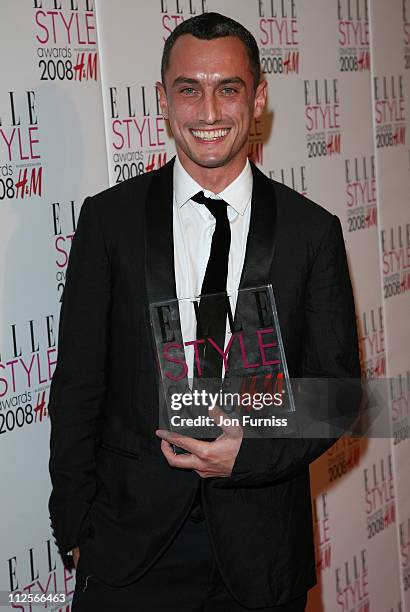 Richard Nicoll poses with his Young Designer Award in the press room at the Elle Style Awards 2008 at The Westway on February 12, 2008 in London,...