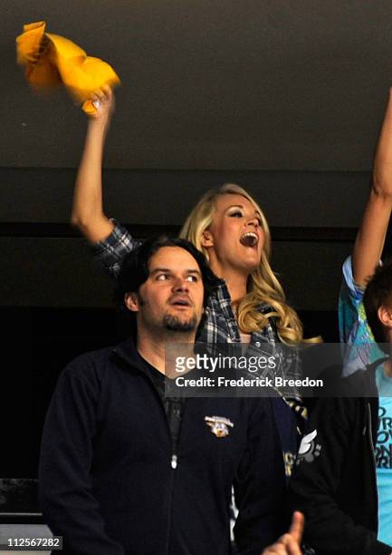 Country singer Carrie Underwood celebrates after her husband Mike Fisher of the Nashville Predators scores a goal against the Anaheim Ducks in Game...