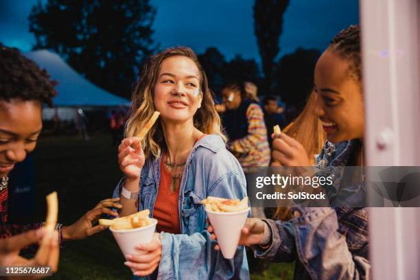 festival food is the best food - eating chips stock pictures, royalty-free photos & images