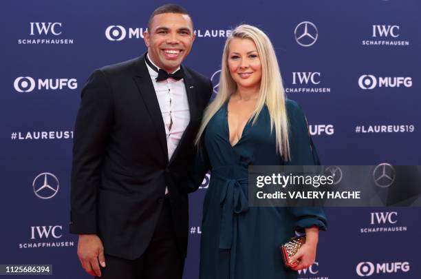 South African rugby union player Bryan Habana poses with his wife Janine Viljoen on the red carpet before the 2019 Laureus World Sports Awards...