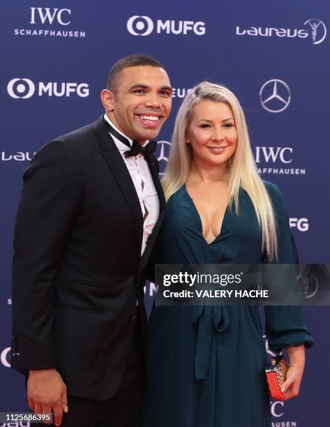 South African rugby union player Bryan Habana poses with his wife Janine Viljoen on the red carpet before the 2019 Laureus World Sports Awards...