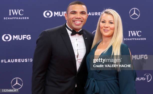 South African rugby union player Bryan Habana poses with his wife Janine Viljoen on the red carpet before the 2019 Laureus World Sports Awards...