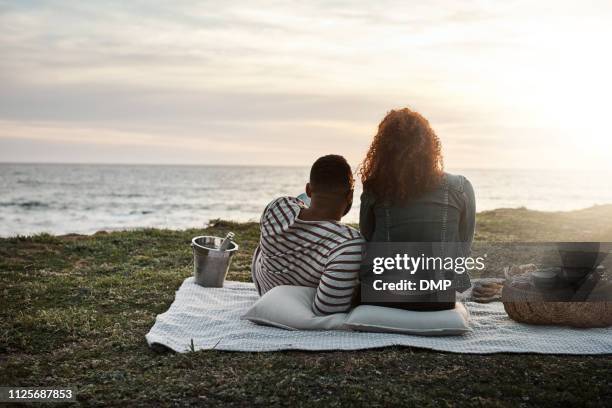 the perfect end to a perfect date - beach picnic stock pictures, royalty-free photos & images