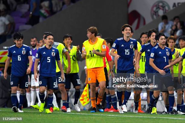 Yuya Osako of Japan celebrates after scoring his sides first goal with team mates during the AFC Asian Cup semi final match between Iran and Japan at...