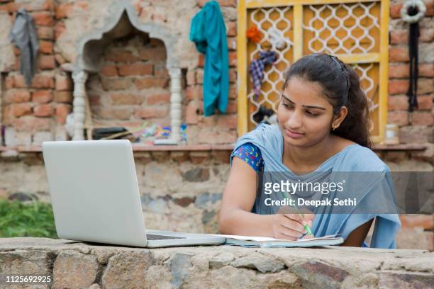 girl working on laptop - stock images, - rural scene stock pictures, royalty-free photos & images