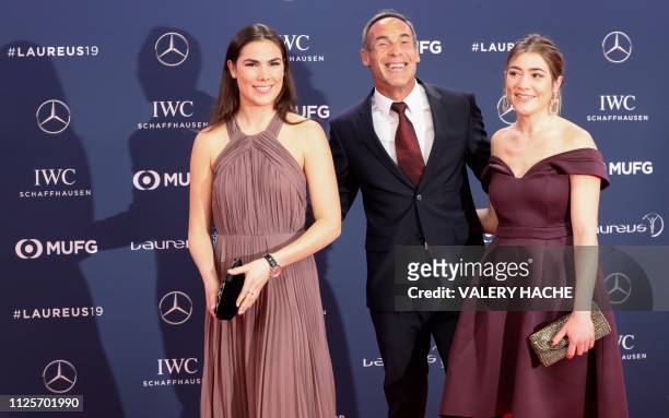 South African-Swiss adventurer and explorer Mike Horn poses with his daughters Annika Horn and Jessica Horn on the red carpet before the 2019 Laureus...