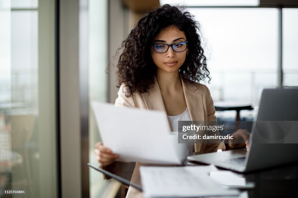Young businesswoman preparing for business meeting