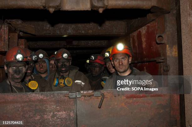 Coal miners are seen returning from their shift in an elevator which transports them 1200 meters below the surface. The State owned Kalinin Coal Mine...