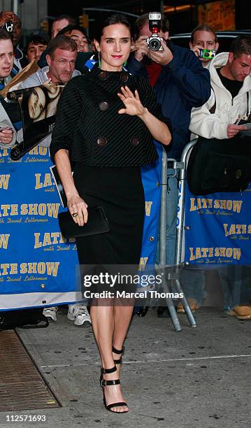 Actress Jennifer Connelly poses for photographers outside the Ed Sullivan theater after appearing on the "Late Show with David Letterman" October 30,...