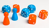 Pawns and colored dice for board games