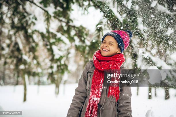 snowball hit - kids playing snow stock pictures, royalty-free photos & images