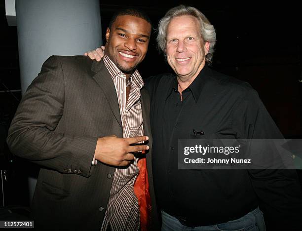 Osi Umenyiora and Steve Tisch attend Michael Strahan's Santa's BIG Helper Christmas Party at Club Slate December 17, 2007 in New York City.