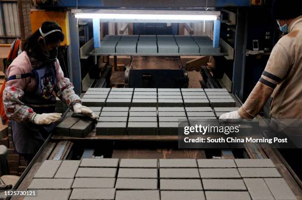 Bricks made from glass are seen at Laputa glass recycling plant in Tuen Mun. 14JAN13