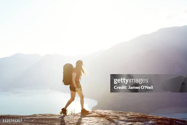 Female hiking alone with background mountains