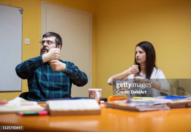 Teach In Sign Language Teaching American Sign Language Photos and Premium High Res Pictures ...