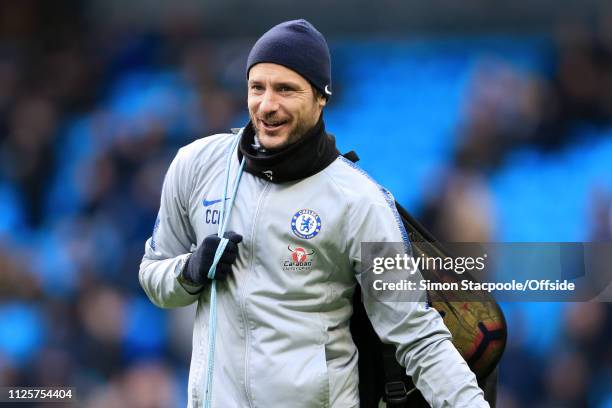 Chelsea assistant Carlo Cudicini carries a bag of balls during the Premier League match between Manchester City and Chelsea at the Etihad Stadium on...