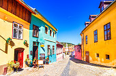 Sighisoara, Romania: Famous stone paved old streets with colorful houses in the medieval city-fortress