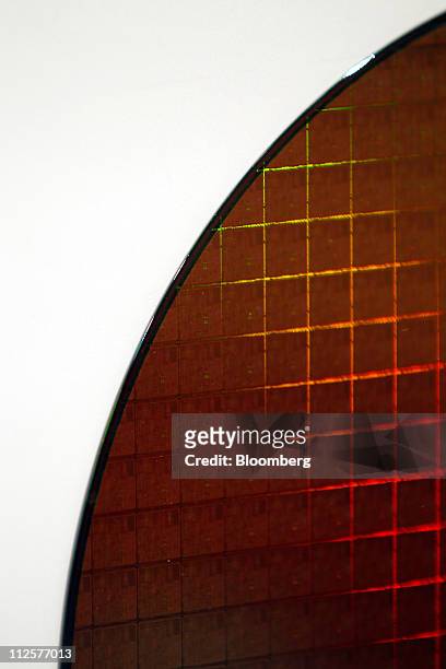 An Intel Corp. Pentium 4 wafer is displayed at the company's museum in Santa Clara, California, U.S., on Tuesday, April 19, 2011. Intel Corp., the...