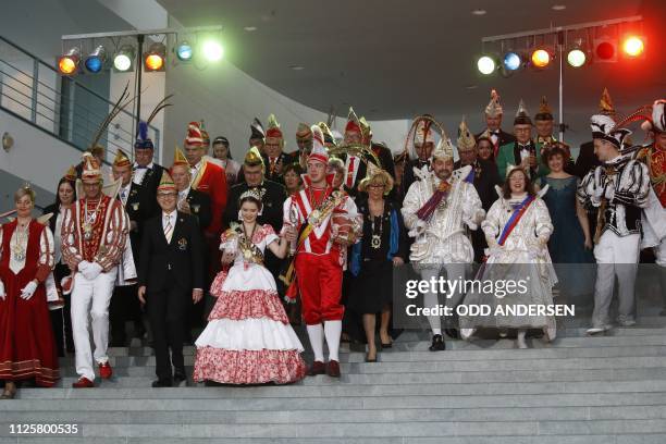 Carnivalists attend a carnival reception at the chancellery in Berlin on February 19, 2019. - German Chancellor Angela Merkel receives carnivalists...