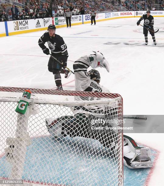 Connor McDavid of the Edmonton Oilers is stopped by Devan Dubnyk of the Minnesota Wild during the 2019 Honda NHL All-Star Game at SAP Center on...