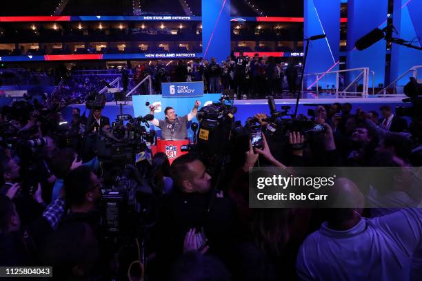 Quarterback Tom Brady of the New England Patriots talks to the media during Super Bowl LIII Opening Night at State Farm Arena on January 28, 2019 in...