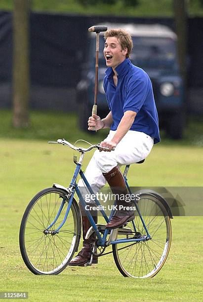 Britain's Prince William participates in the bicycle portion of the Jockeys vs. Eventers charity polo match July 13, 2002 at Tidworth Polo Club,...