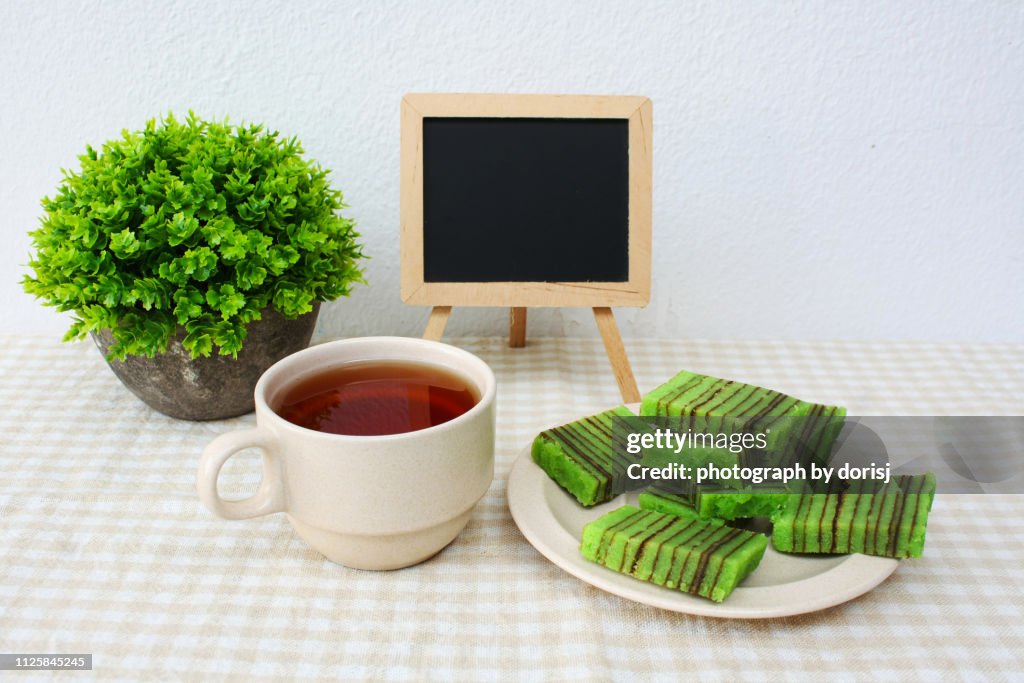 Sarawak traditional steamed layered cake served with tea