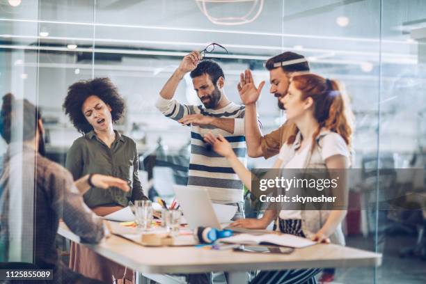group of frustrated freelance workers having problems in the office. - disappoint bussiness meeting stock pictures, royalty-free photos & images