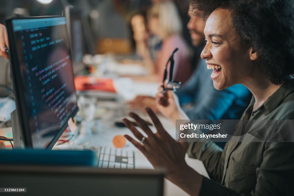 Cheerful African American Computer Programmer Celebrating Success In ...