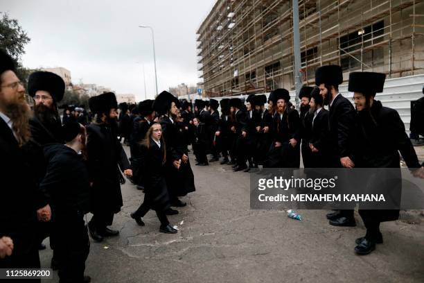 Ultra-Orthodox Jews of the Gerrer Hasidic dynasty dance during the wedding ceremony of the grandson of their rabbi Yaakov Aryeh Alter in Jerusalem on...