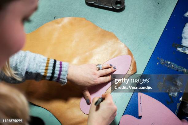 woman shoemaker working at her workshop - mold on shoes stock pictures, royalty-free photos & images