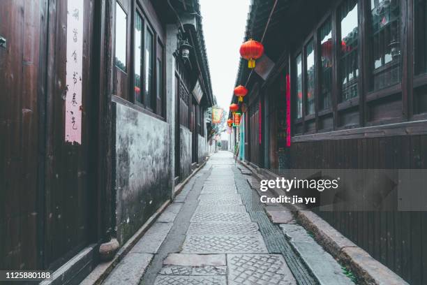 traditional buildings with red lanterns hanging in dangkou town - jiangsu stockfoto's en -beelden