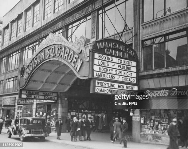 The marquee at the entrance to the Madison Square Garden indoor arena on Eighth Avenue between 49th and 50th Streets in Manhattan, New York City,...