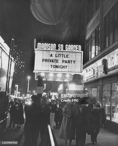 Sign advertising 'A little Private Party', above the entrance to the Madison Square Garden indoor arena on Eighth Avenue between 49th and 50th...