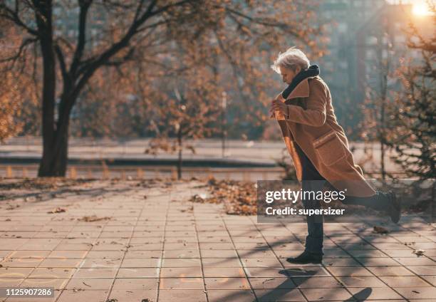 senior woman having fun outside - hopscotch stock pictures, royalty-free photos & images