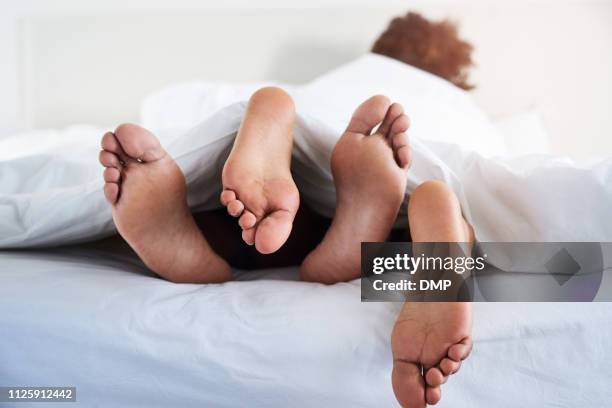 i like it when you're this close - feet in bed stock pictures, royalty-free photos & images