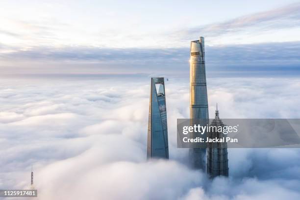 aerial view of shanghai lujiazui financial district in fog - aircraft skyscrapers ストックフォトと画像