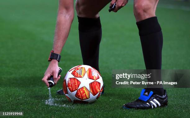 Referee Gianluca Rocchi uses vanishing spray during the UEFA Champions League round of 16 first leg match at Anfield, Liverpool.