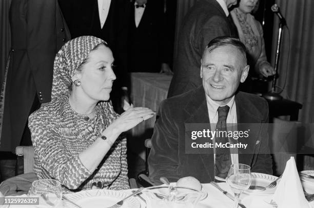 Irish actress Valerie Hobson talking to English-American novelist Christopher Isherwood at the lunch given by Foyles Bookshp, at the Dorchester Hotel...