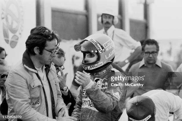Austrian Formula One driver Niki Lauda discussing with Italian mechanical engineer of Ferrari Mauro Forghieri at the Dutch Grand Prix, Circuit Park...