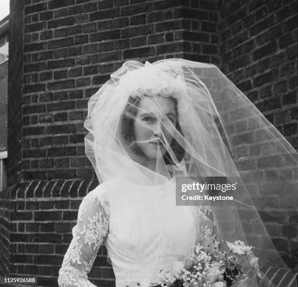 British primatologist Jane Goodall at her wedding to wildlife photographer Hugo Arndt Rodolf, Baron van Lawick at the Chelsea Old Church in London,...