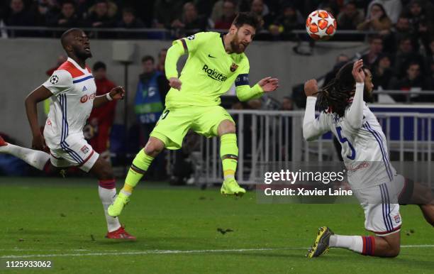 Captain Lionel Messi of FC Barcelona in action with Tanguy Ndombele and Jason Denayer of Olympique Lyonnays during the UEFA Champions League, Round...