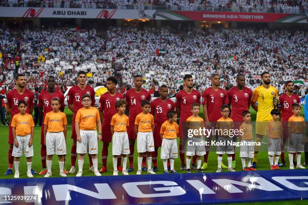 The Qatar team listens to the national anthems prior to the AFC Asian Cup semi final match between Qatar and United Arab Emirates at Mohammed Bin...