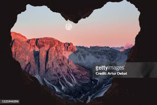 romantic landscape with heart shape of the alps mountains with full moon. - romantic sky stock pictures, royalty-free photos & images